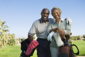 Picture of retired couple on golf course.